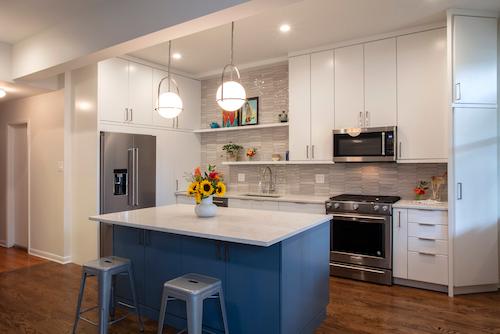 Vintage inspired condo kitchen with hanging globe-shaped lights.