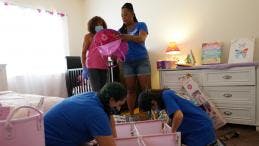 Vickie and volunteers prep bedroom makeover for young girl.