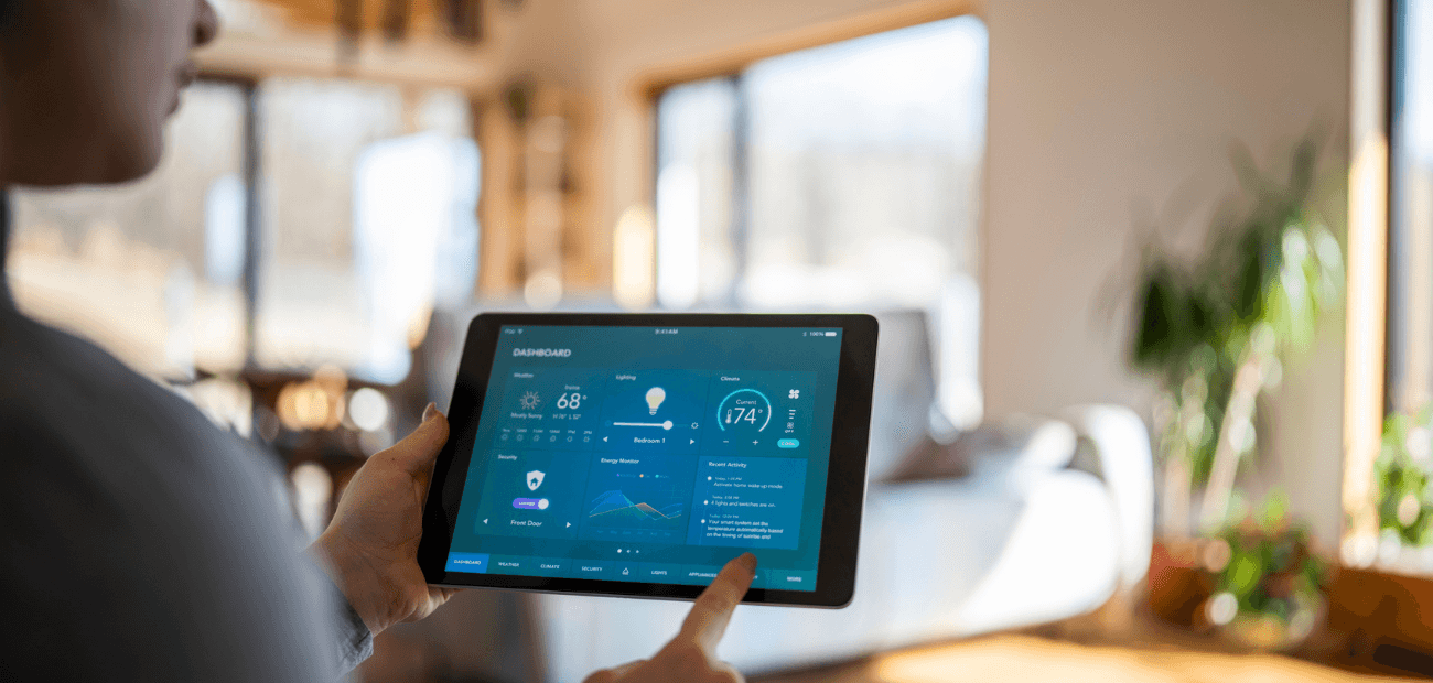 Woman using tablet with smart home control functions