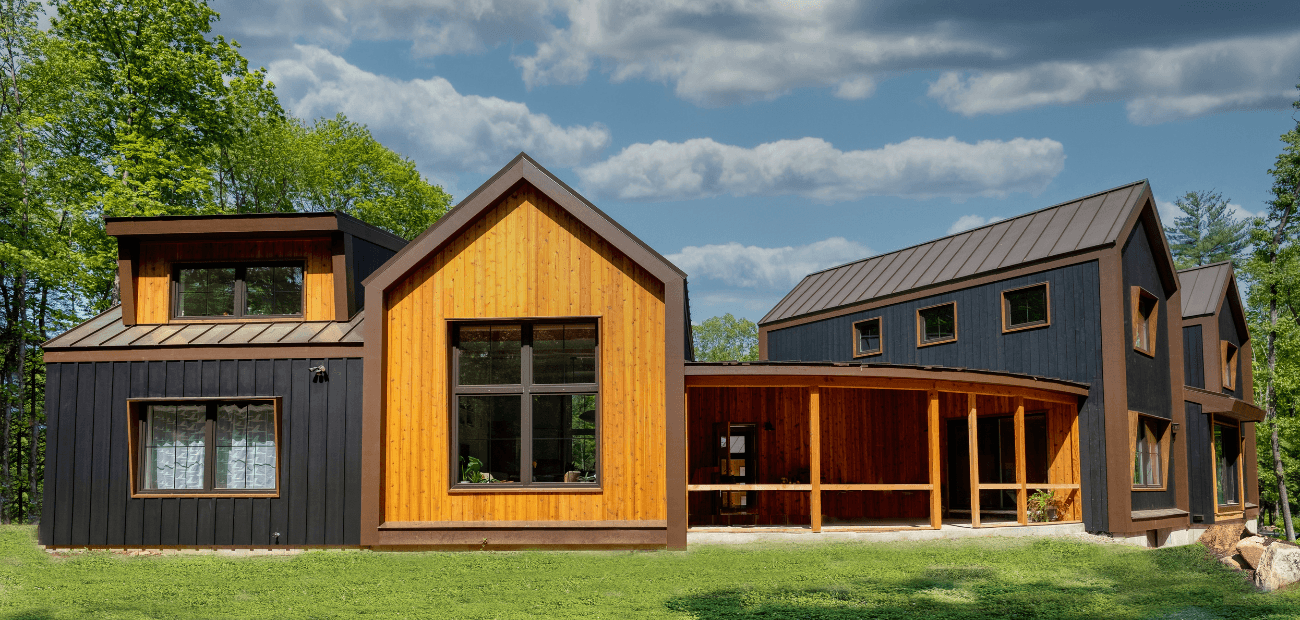 A large two-story home with an accessory dwelling unit attached by a covered walkway