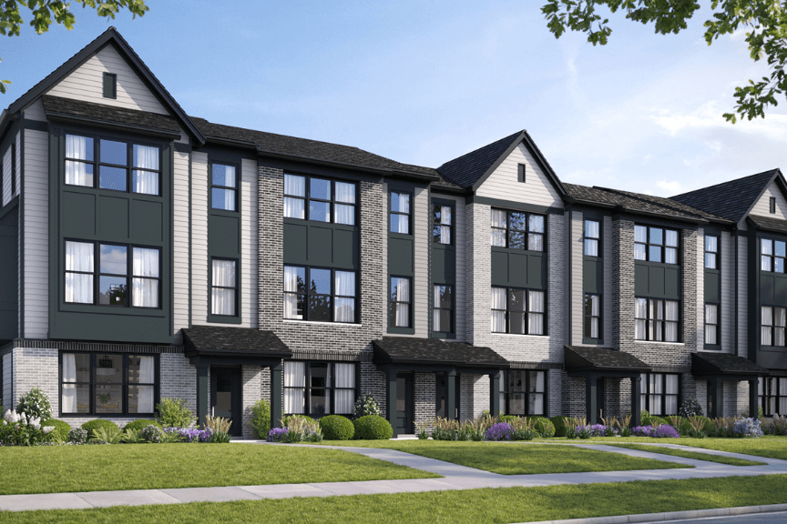 A modern townhome complex with gray and brick exterior