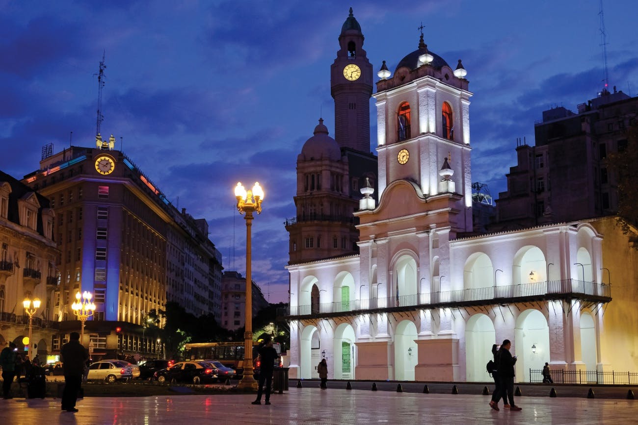 European clock tower, downtown at night