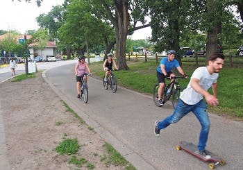 People riding bicycles in an urban area park in Minneapolis