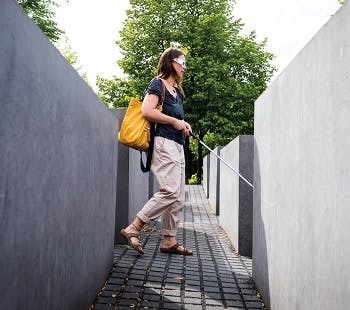 Visually impaired woman walking inside the Holocaust Memorial, Berlin