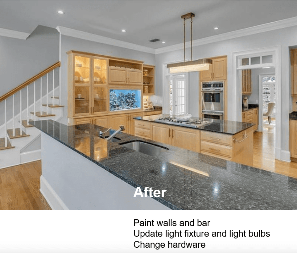 A kitchen with pendant lighting and white cabinets