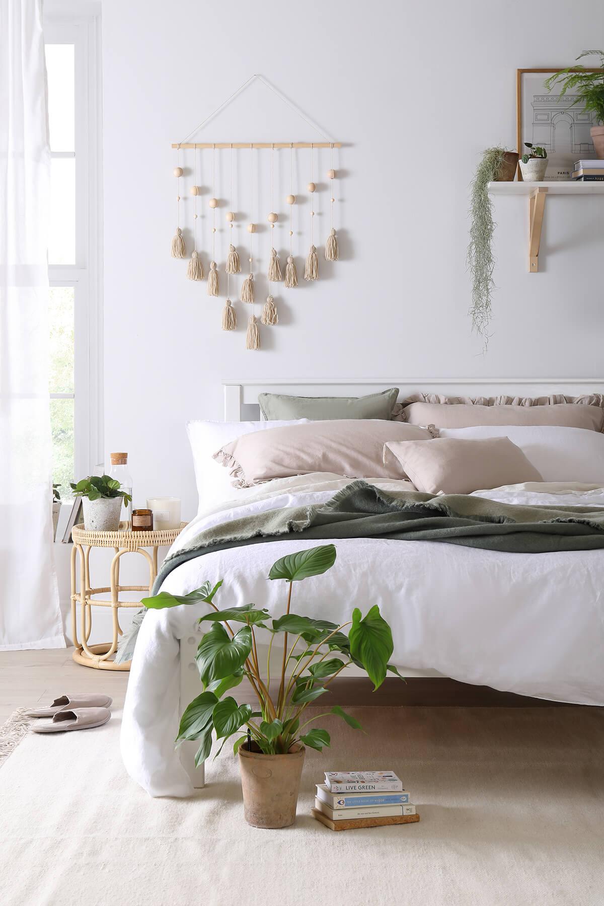 A bedroom showing neutral colored accents and furniture