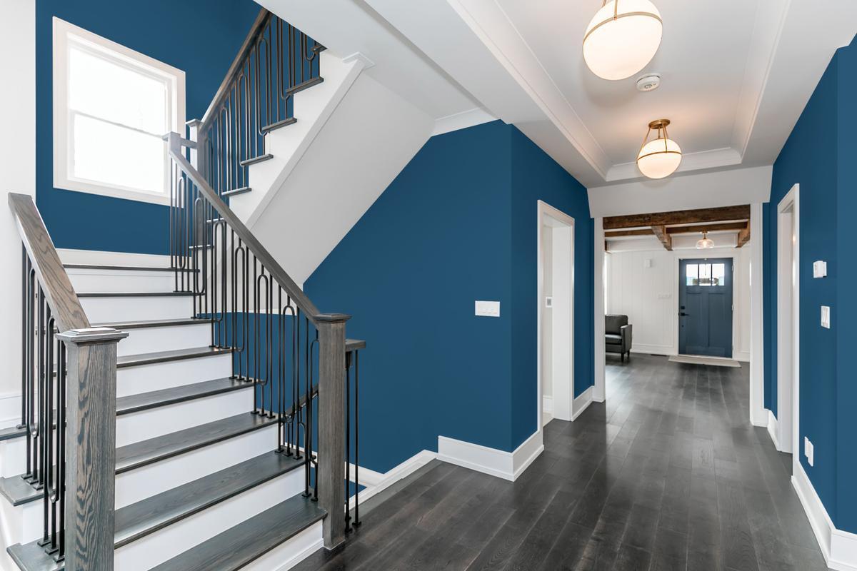 Stairwell with Blue walls and white accent