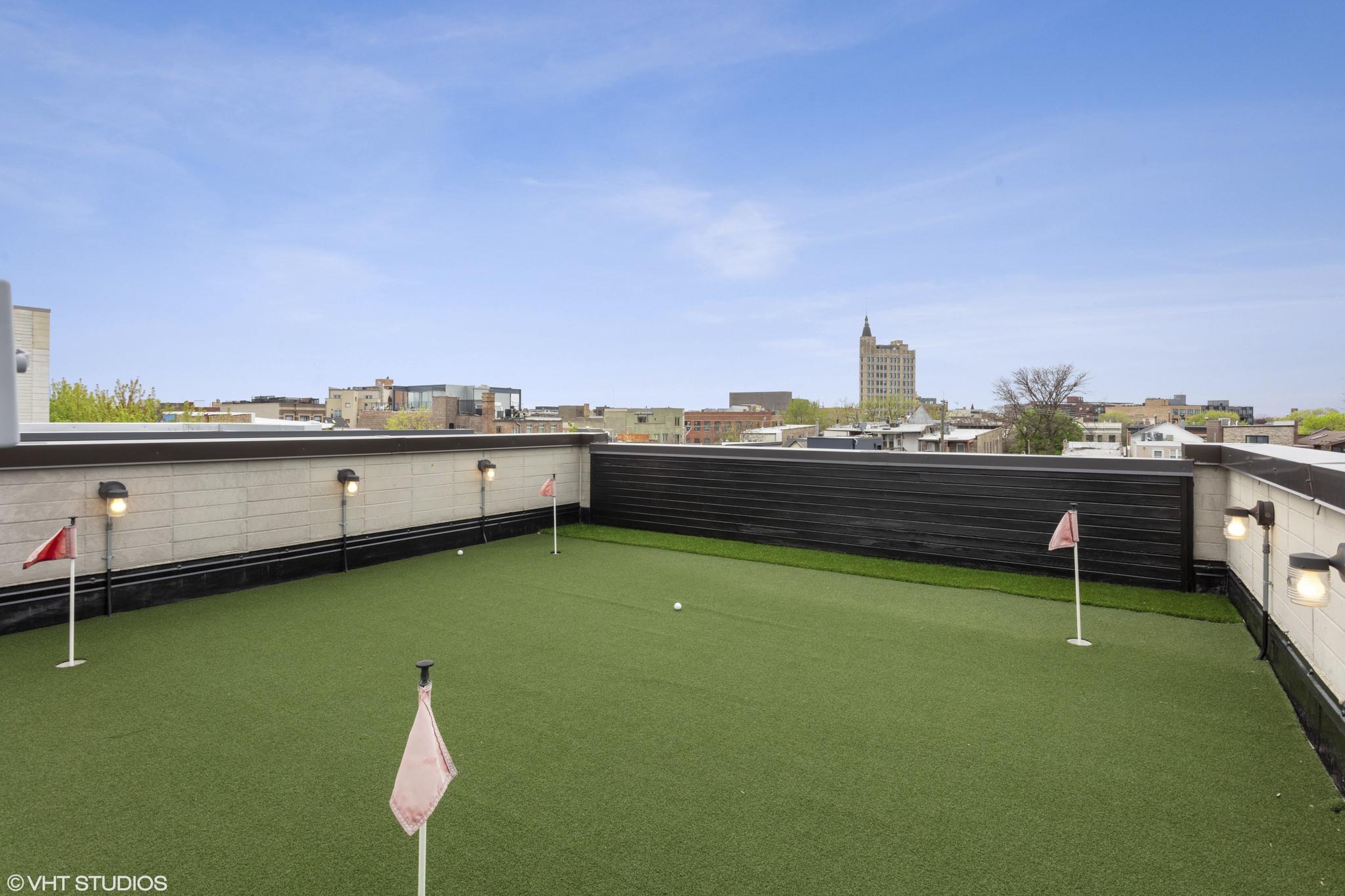 An artificial putting green on a home's rooftop. 