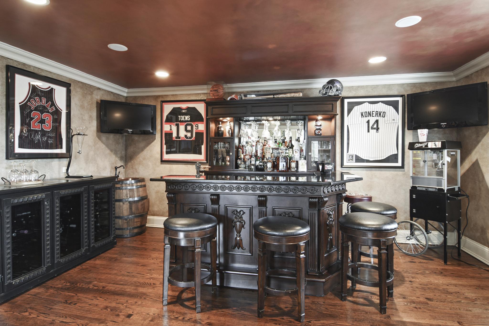 A home bar with sports memorabilia