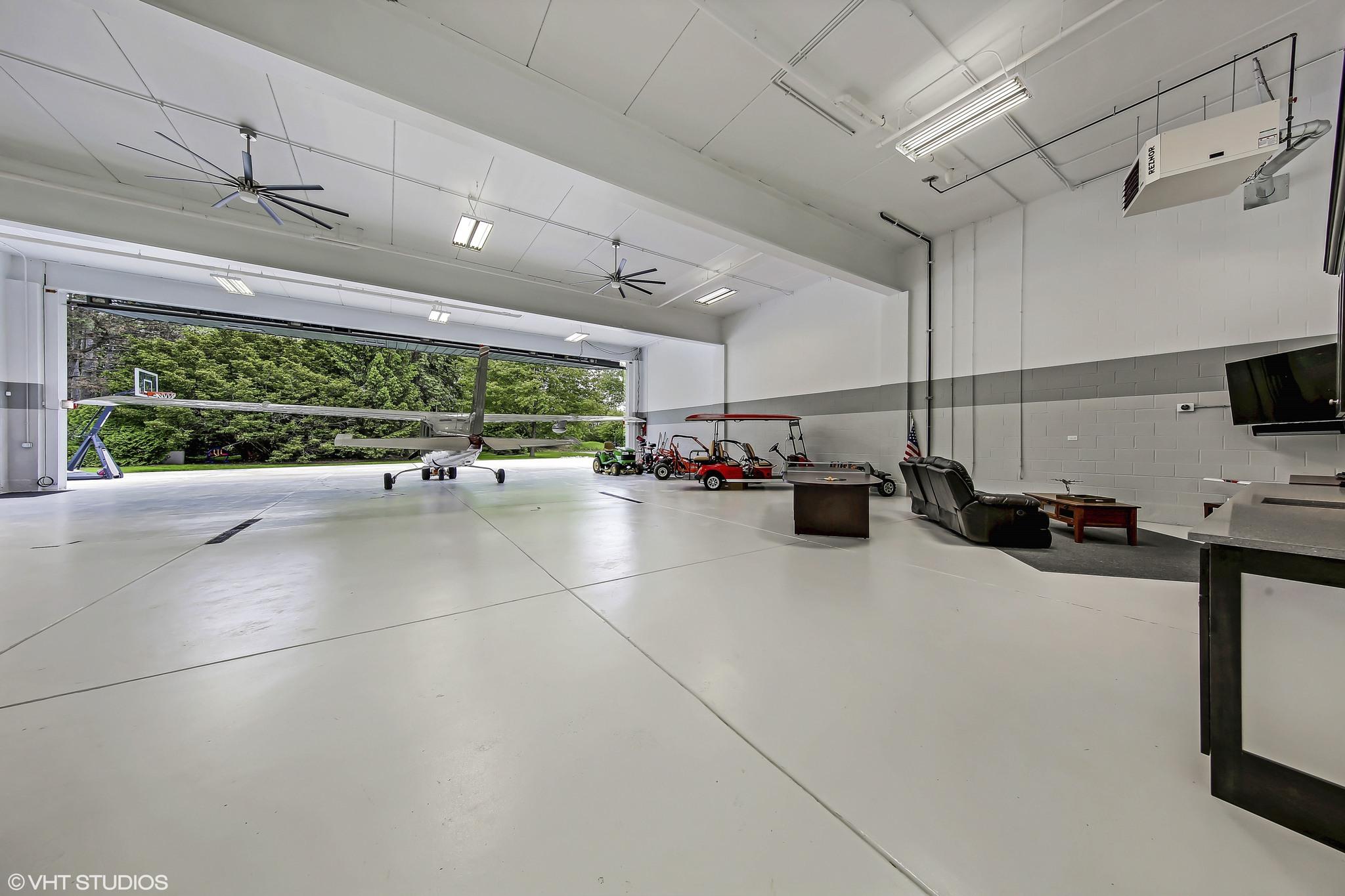 Small airplane hangar in luxury home 