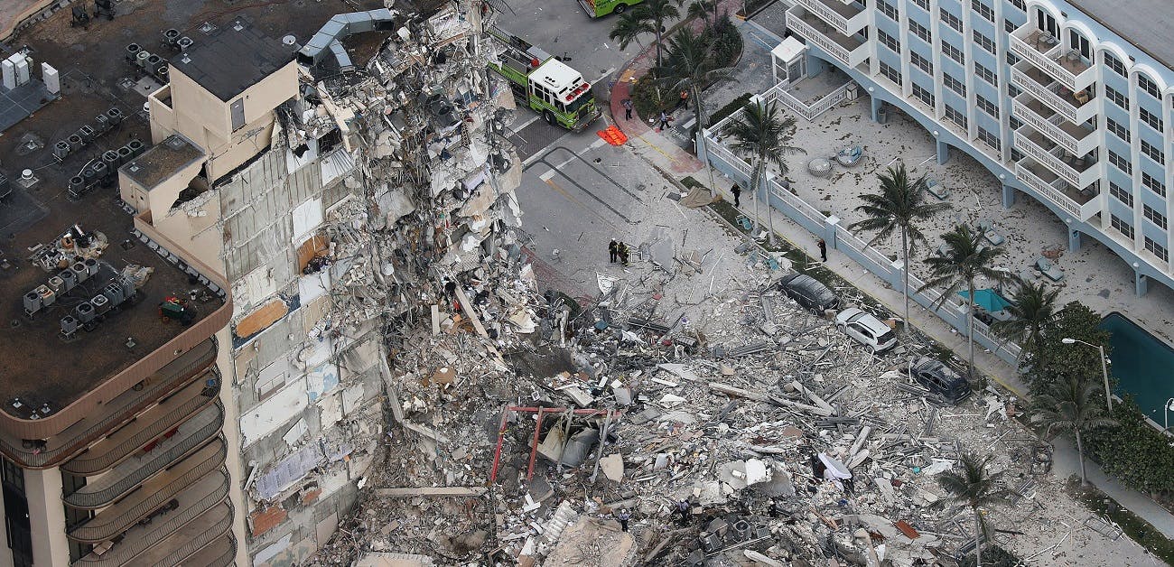 Search and rescue personnel sift through the rubble after the partial collapse of the 12-story Champlain Towers South condo buil