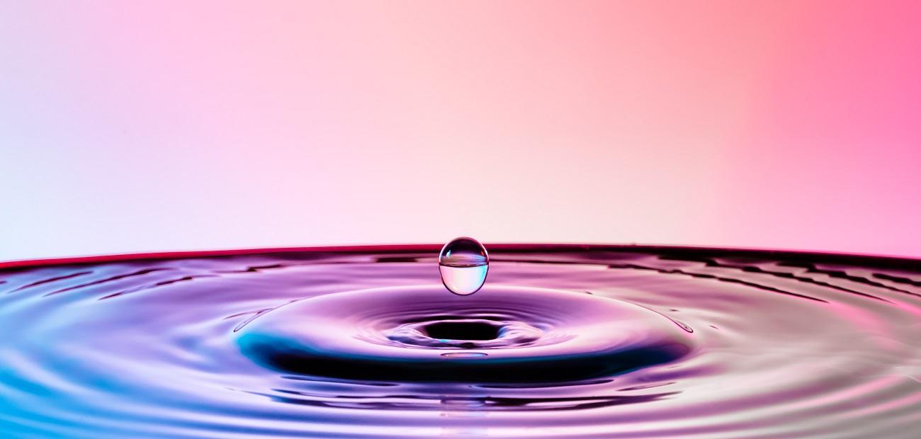 Close-Up Of Droplet Splashing In Water