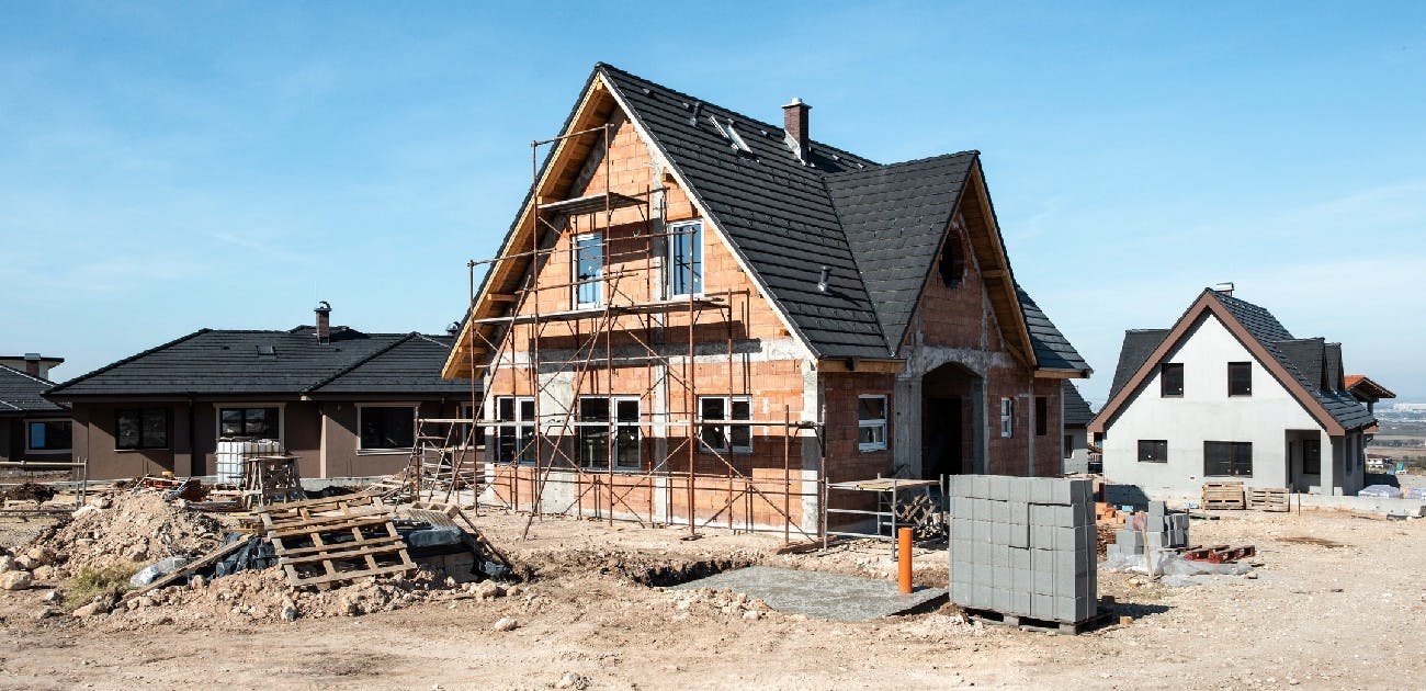 A picture of a newly constructed house that remains incomplete.