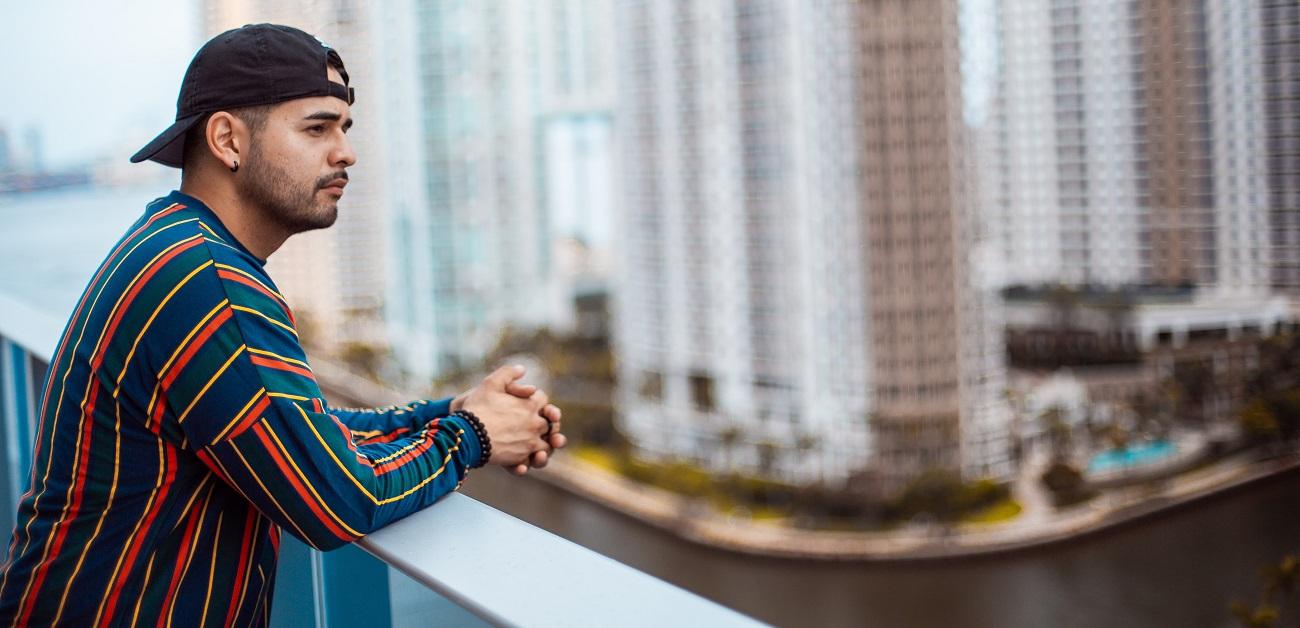 Latino man on balcony