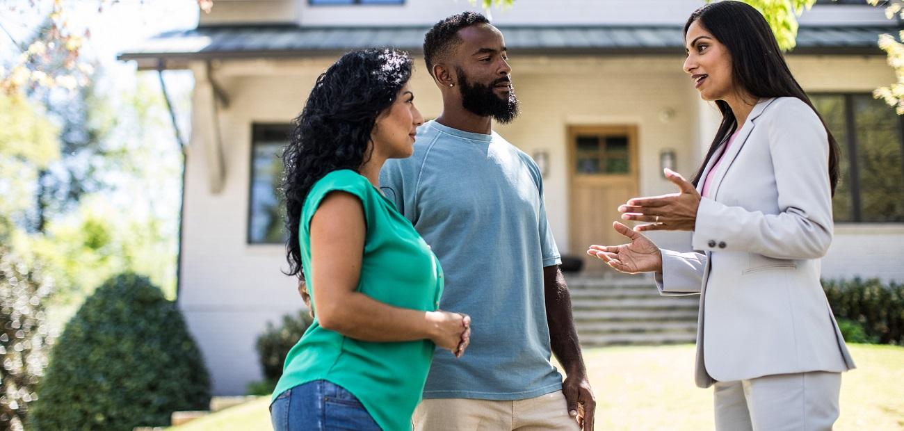 Couple meeting with real estate agent