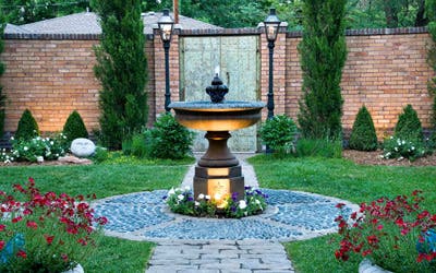 small garden with path, water fountain