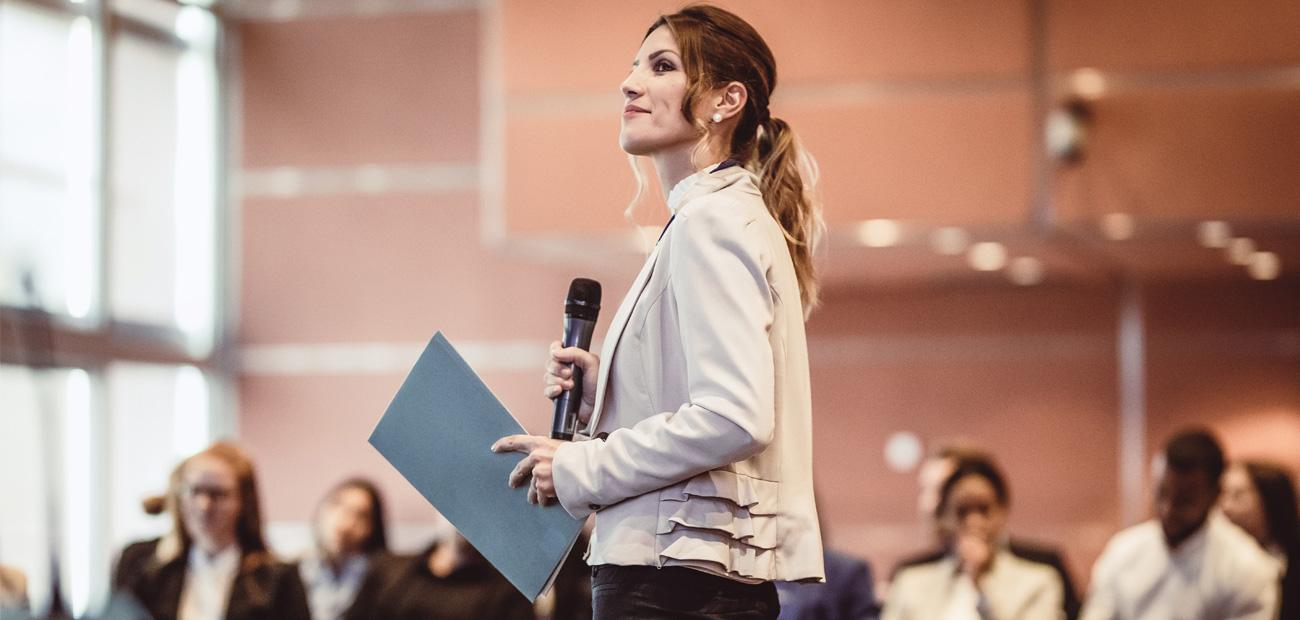 Business People Listening to the Speaker at a Conference