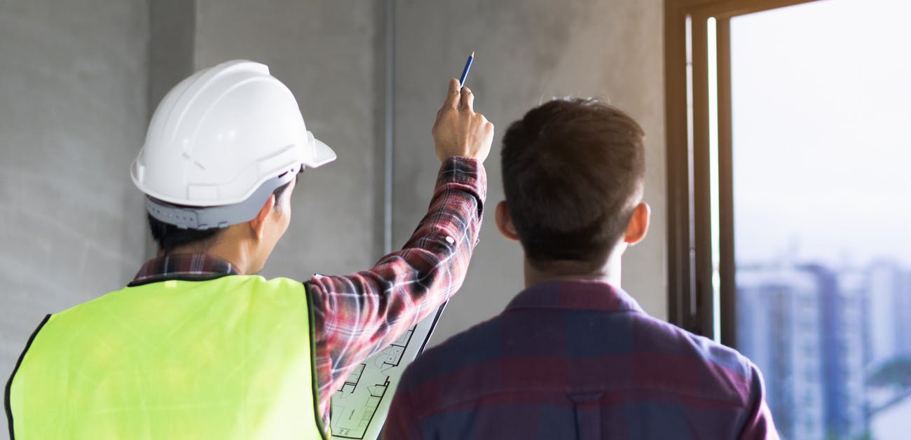 Inspector and client looking at condo unit