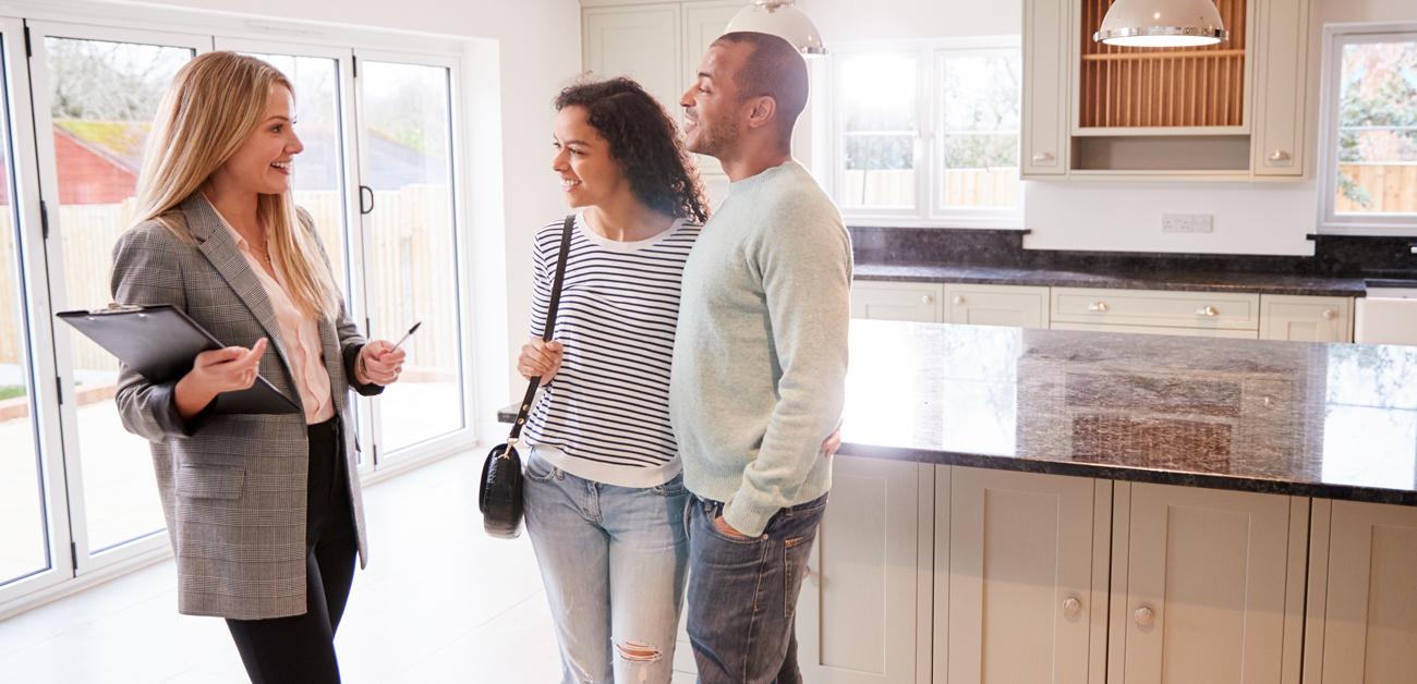 Couple viewing empty home