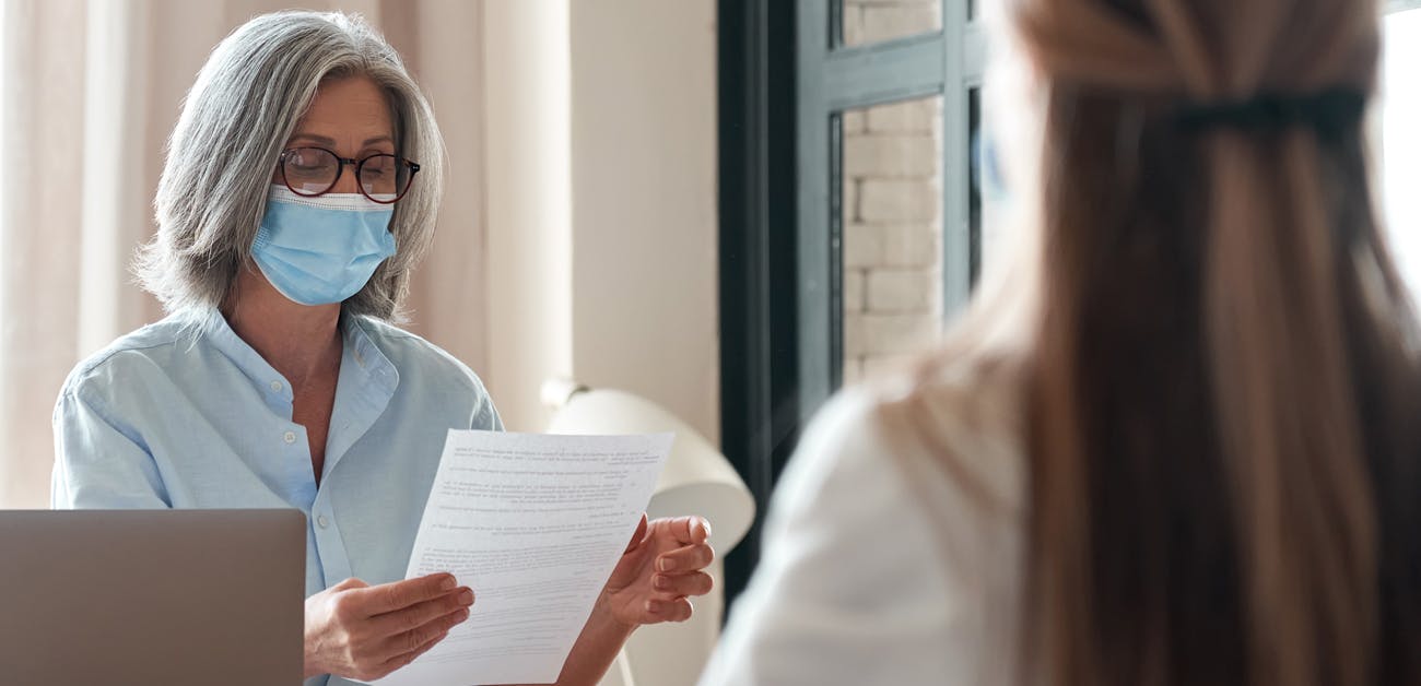 Middle aged woman working with younger woman