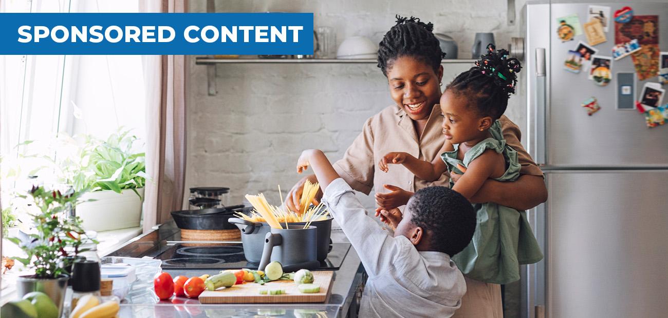 Family making dinner in kitchen