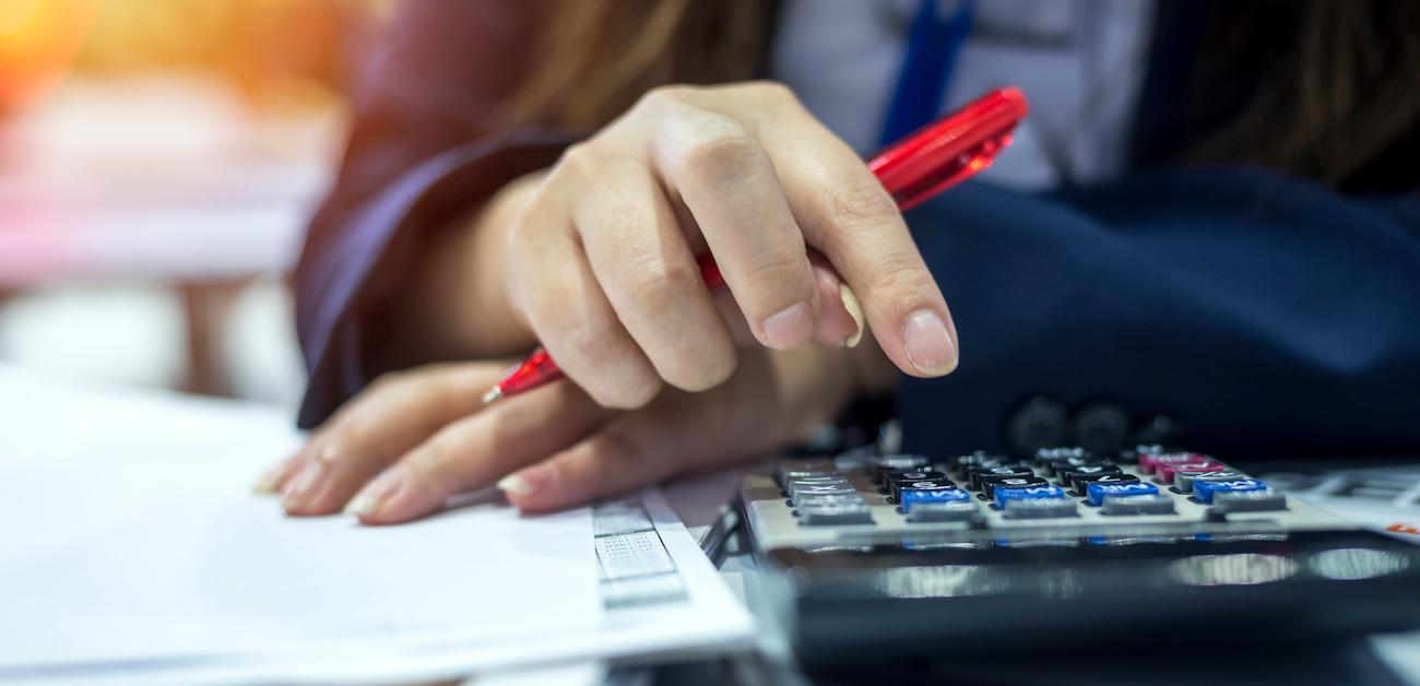 Woman using calculator