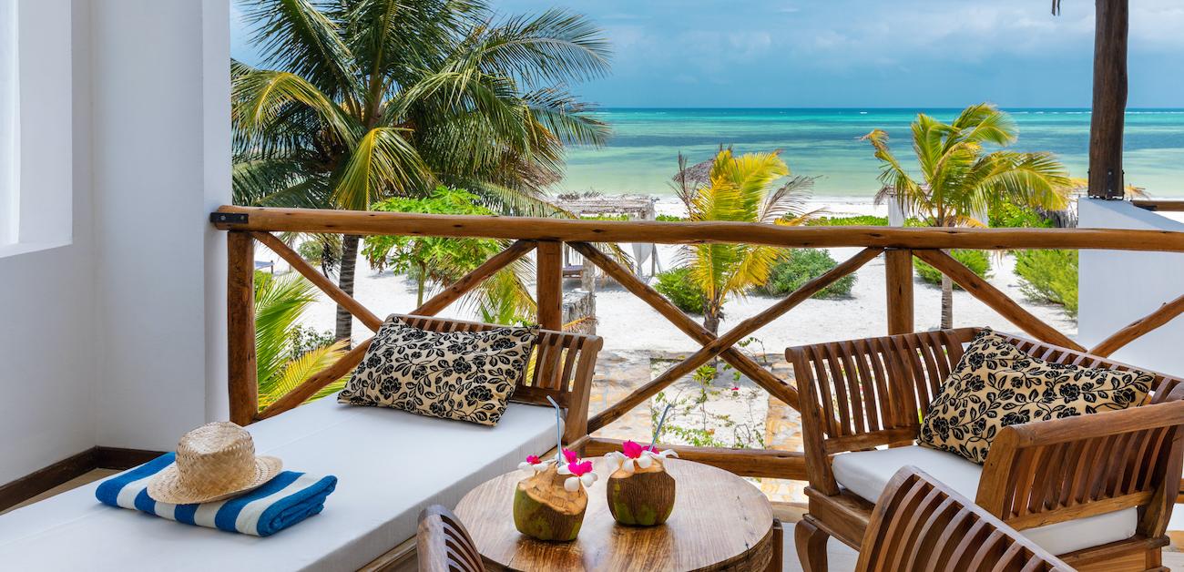 Vacation home deck overlooking a beach.