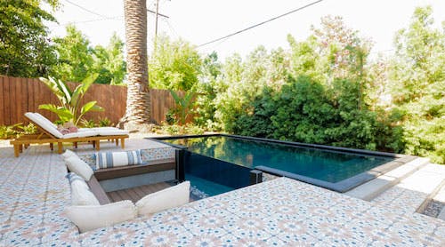 Container pool surrounded by tile deck.