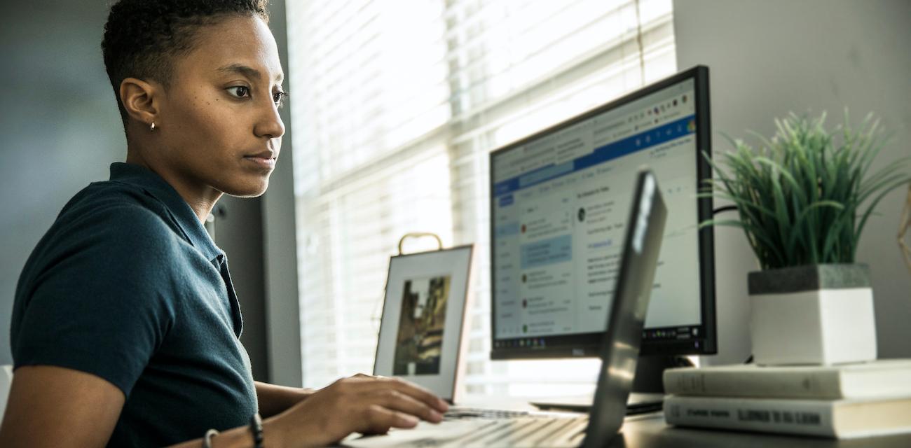 Woman working on desktop computer