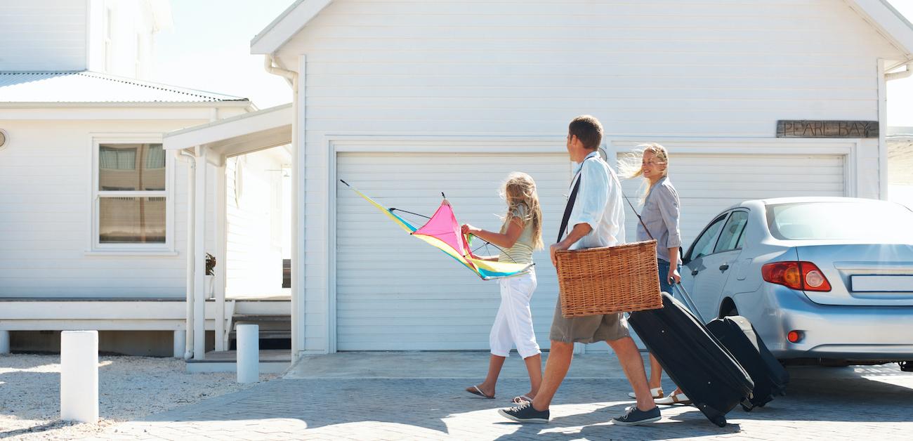 Family walking up to vacation rental house