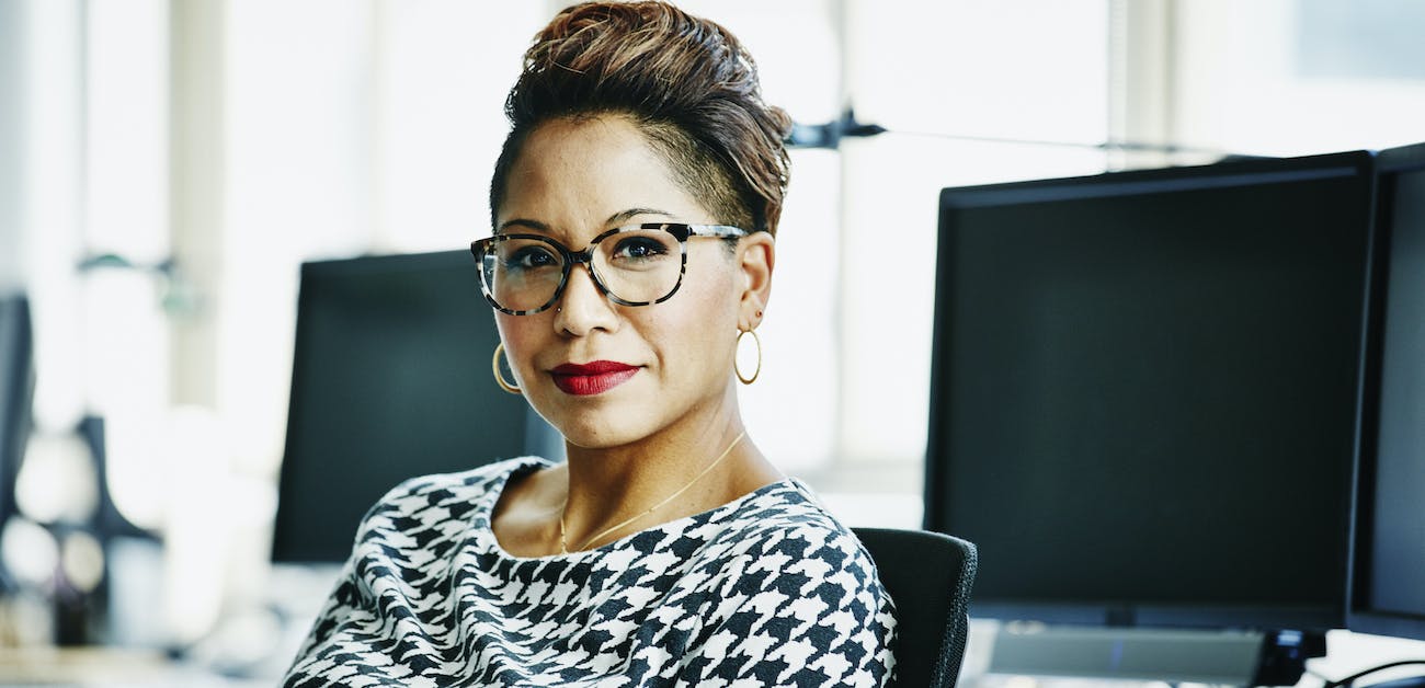 Businesswoman seated at office workstation