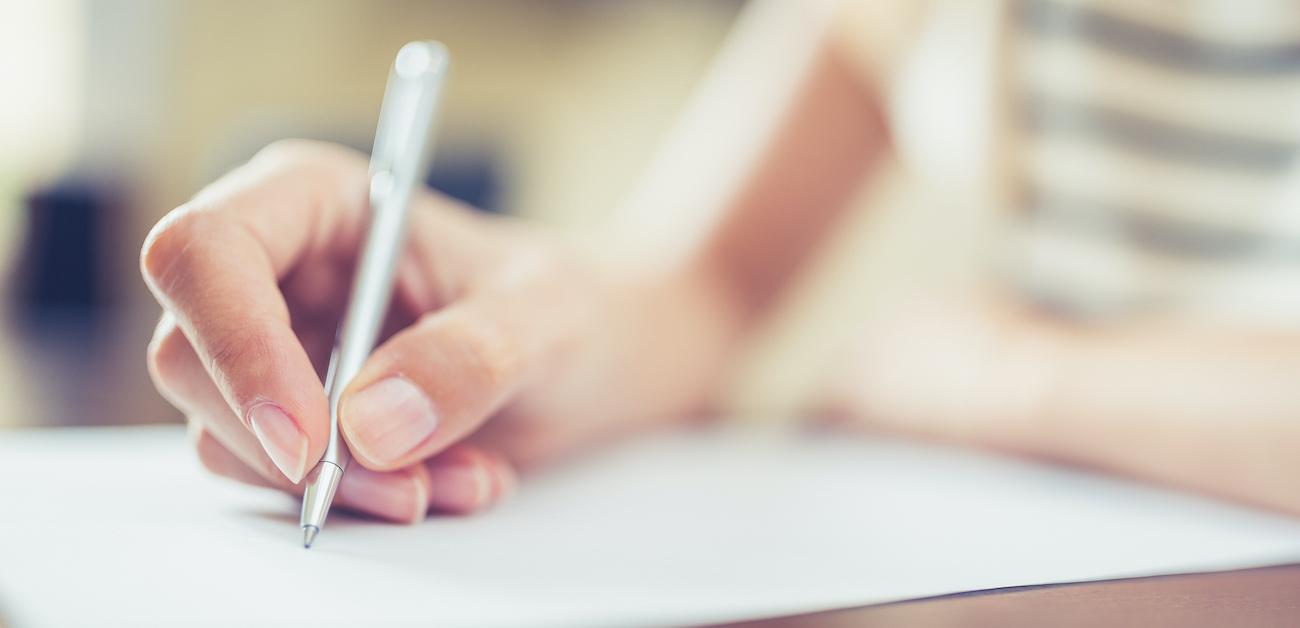 Woman handwritting a letter