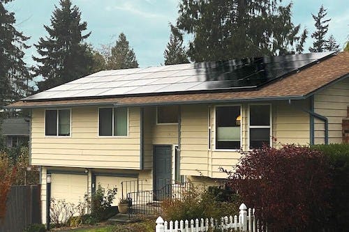 Yellow house with solar panels