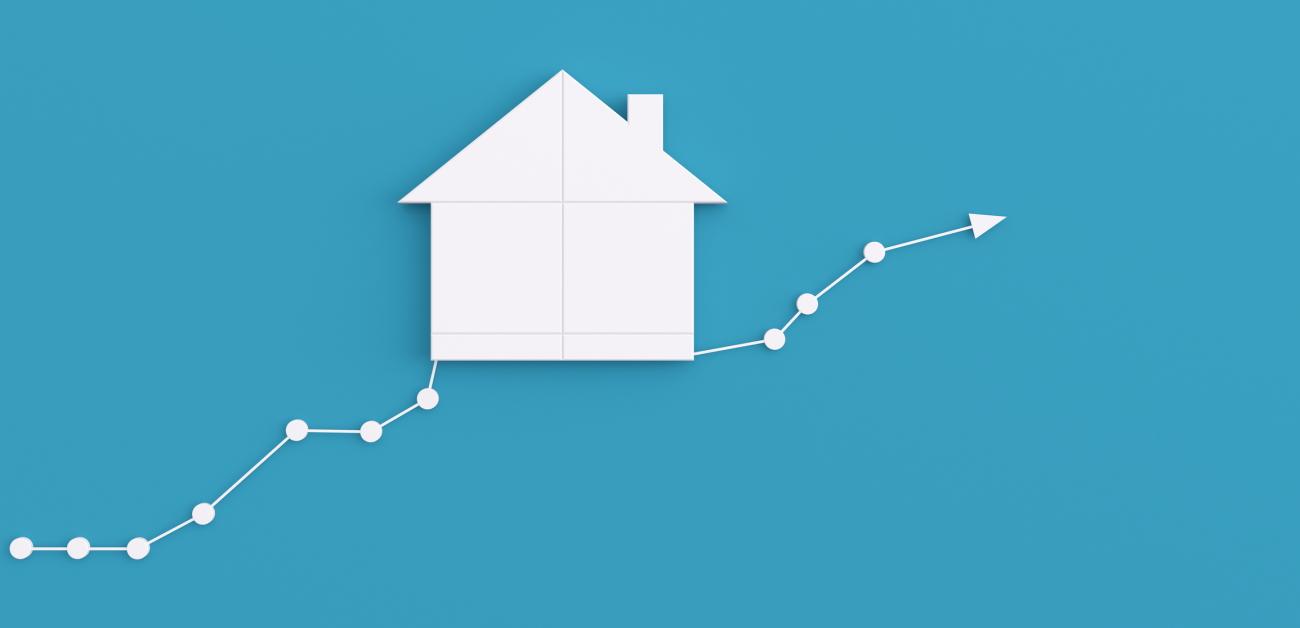 Chart with rising plot points and a house image