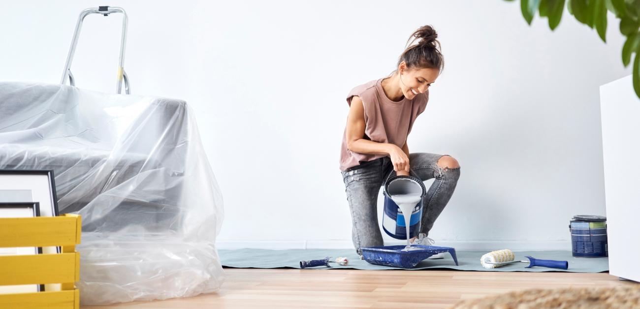 A keeling woman mixing paint