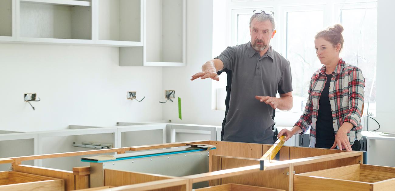 Contractor discussing kitchen remodel with homeowner