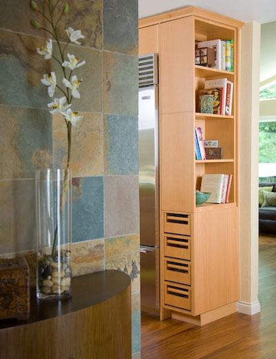 Bookcase on top with onion and potato storage below.