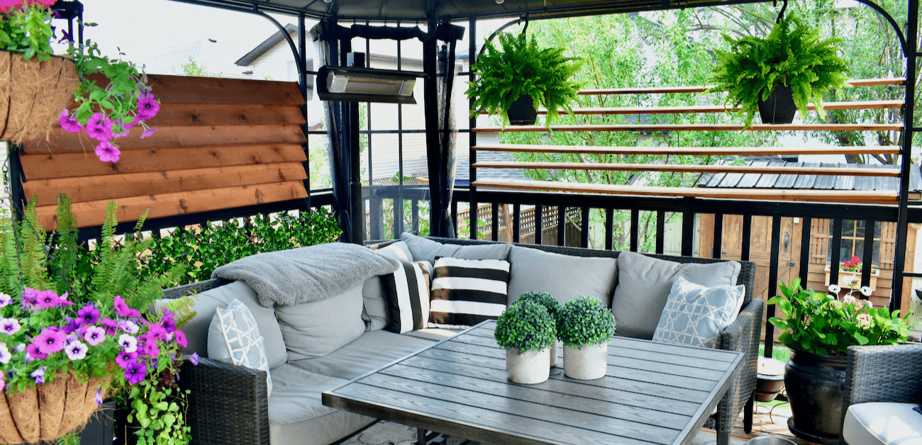 A shaded outdoor space with plans and a seating area