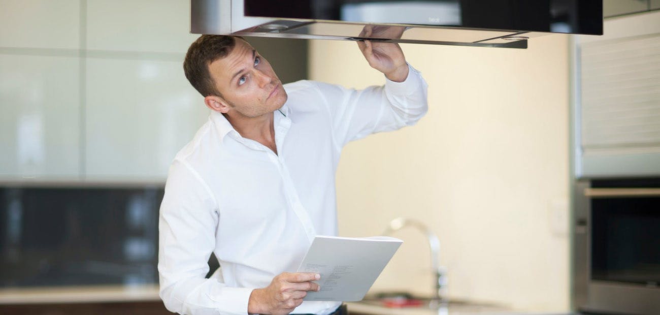 Man Checking Kitchen Hood