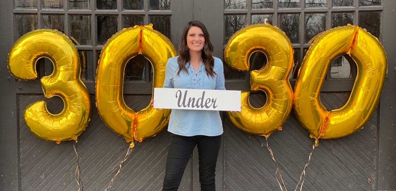 Anna-Marie Hyatt with 30 Under 30 balloons