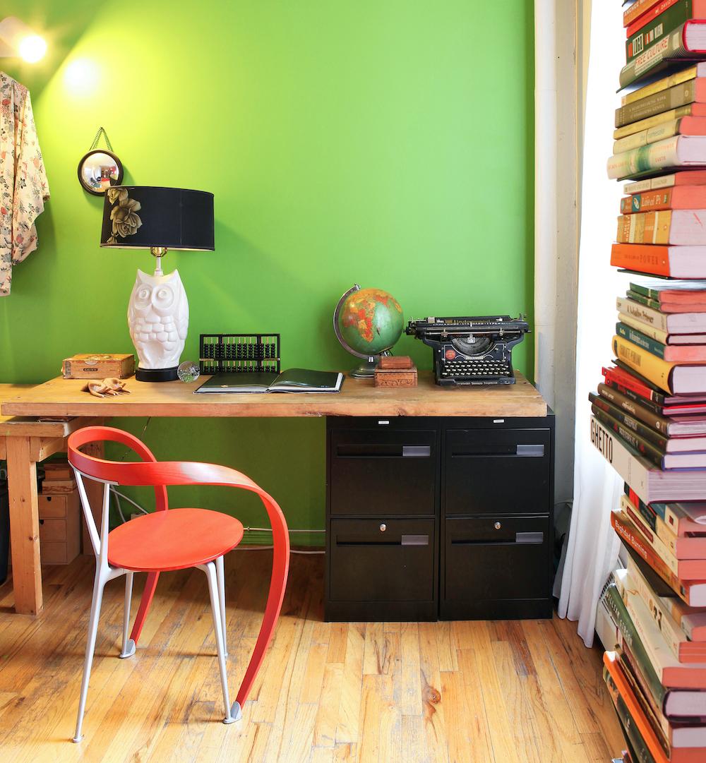 Complementary reds and greens in a personal home office. 