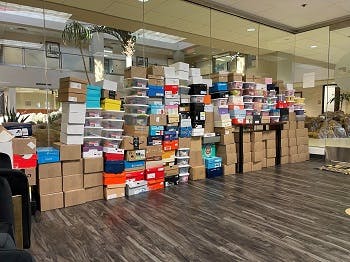 Shoeboxes of toys in Realty One office