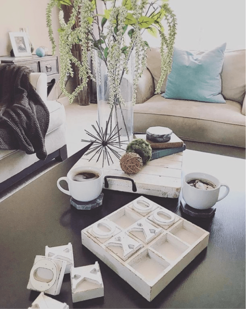 another photo of a coffee table staged with plants