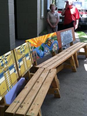 Three of the benches at the “Art of Sitting” unveiling. 