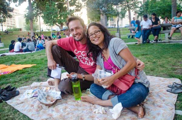 A couple enjoys a picnic before a free concert at Levitt Los Angeles