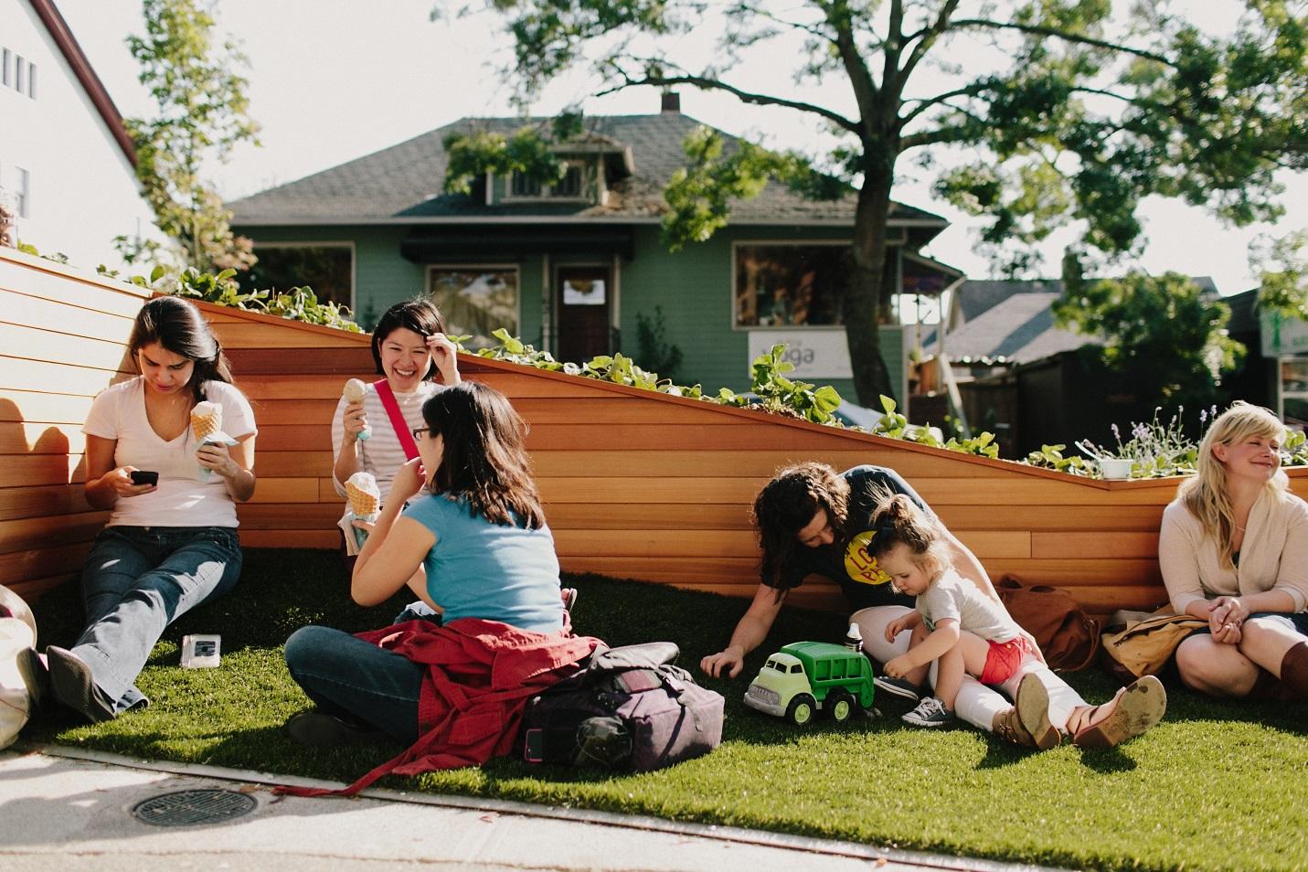 An astroturf slope, swings, and edible plantings are all part of the Molly Moon’s Homemade Ice Cream parklet in the Wallingford neighborhood of Seattle. (Credit: Seattle Department of Transportation)