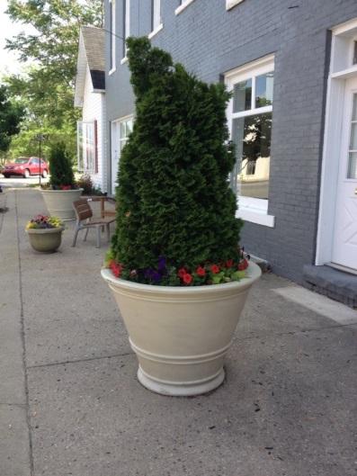 Planters will be added along the alleyway and at both entrances to bring nature elements to the concrete and brick corridor.