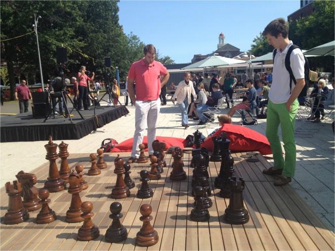 Giant chess, beanbags, a variety of seating, and a large tent for farmers markets and events creates a real sense of place at The Plaza | Photo by PPS