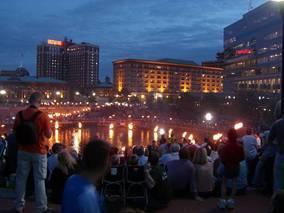 Waterfire, a pyrotechnic public art project, brings crowds to downtown Providence in the evening hours.