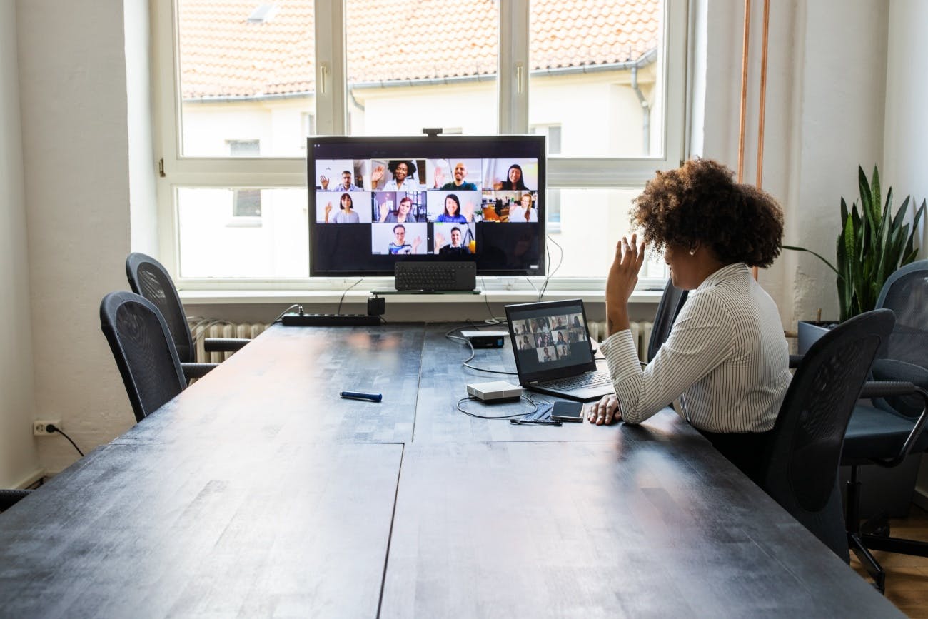 Business woman on virtual call with colleagues